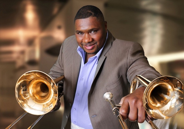 Wycliffe Gordon holding trombones